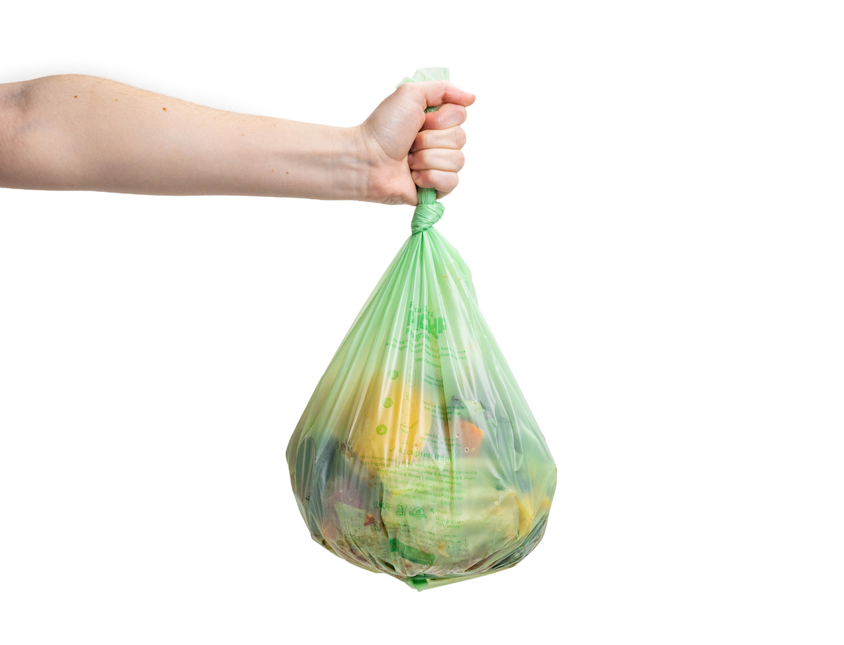 someone holding a filled bag